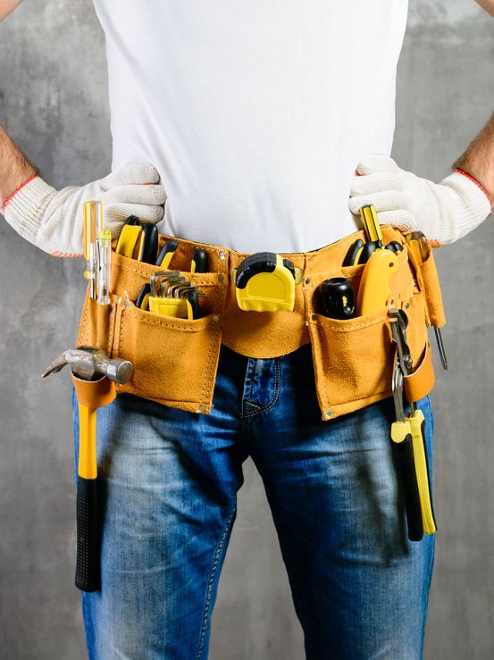 handyman checking air conditioning